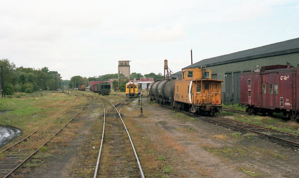 CP caboose and VIA RDC in Kentville, Nova Scotia, 1989